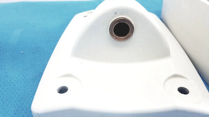 White plastic monitor mounting arm bracket with central circular hole and two smaller corner holes for secure attachment