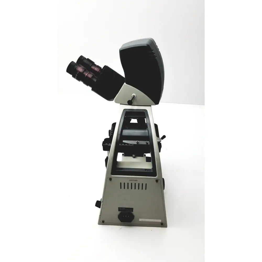 Silver and black motic ba300 biological compound microscope with dual eyepieces and stage for specimen slides tested model