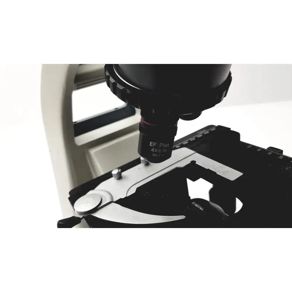 Black ef plan 4x/0.10 objective lens mounted on metallic stage of motic ba300 biological microscope tested model