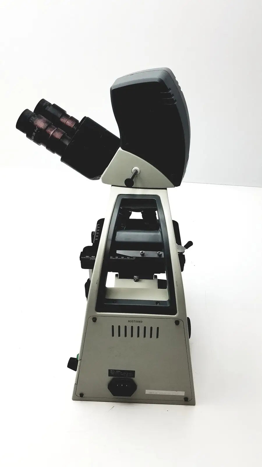 Silver and black motic ba300 biological compound microscope with dual eyepieces and stage for specimen slides tested model