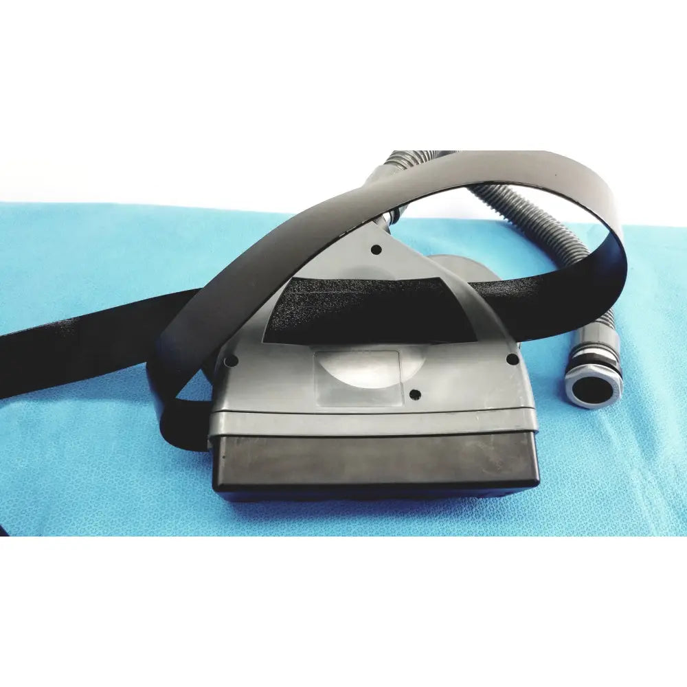 Gray plastic msa optimair tl papr blower unit headgear with black elastic straps and corrugated hose for medical use
