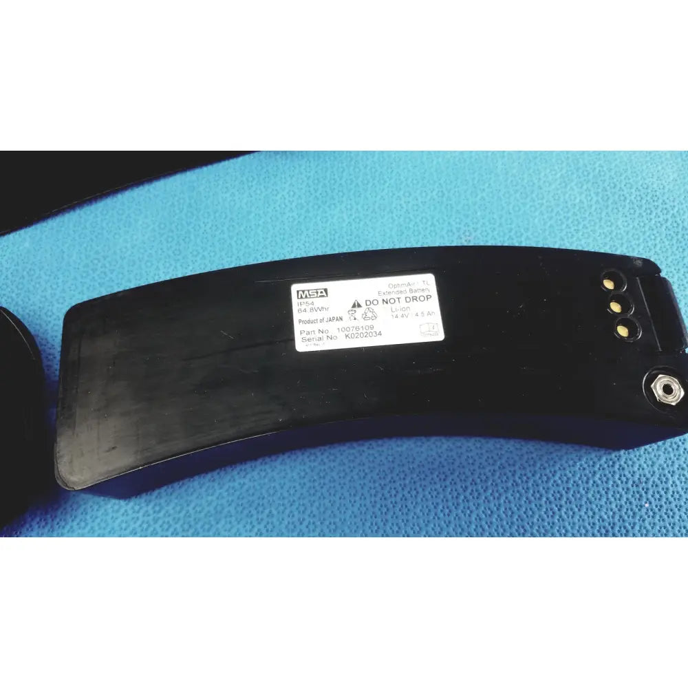 Black msa 64 vwhr extension battery with matte finish and three gold contacts for msa optimair tl papr blower unit