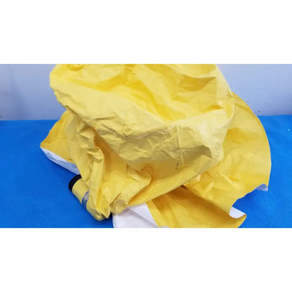 A crumpled yellow paper envelope with white edges for msa yellow safety respirator s-cap hood 10078917 packaging