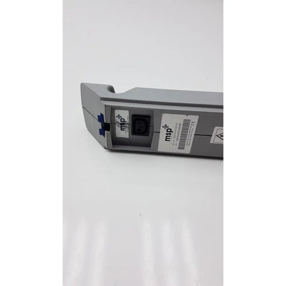 Gray plastic msp battery 24v dc 4ah with black power input and blue locking mechanism for arjo models back side view
