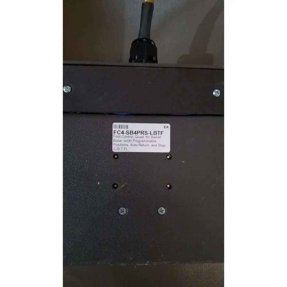 Black industrial control base with white label showing model number fc4-sb4prs-lbt f on mti programmable podiatry chair back side