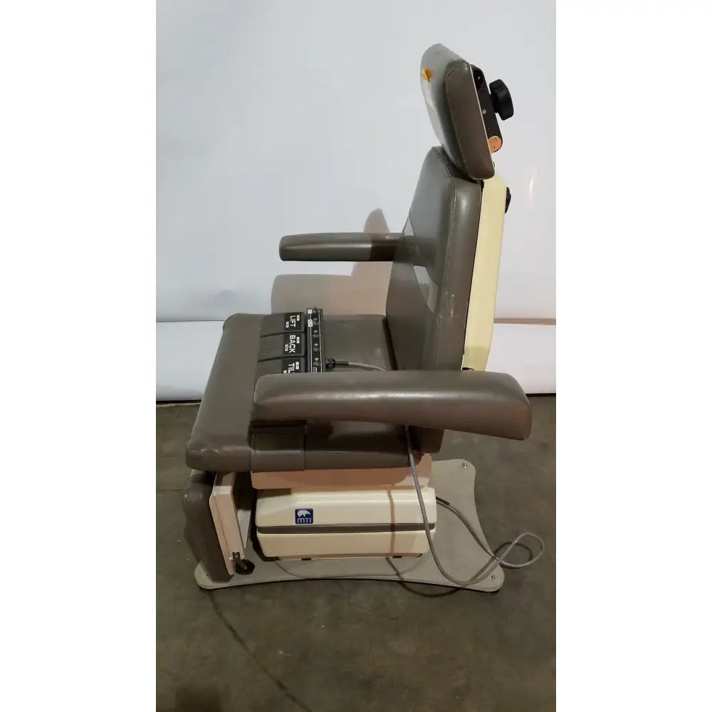 Gray and beige mti programmable podiatry chair with adjustable armrests headrest and integrated foot control panel
