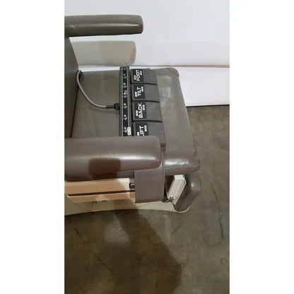 Gray leather mti programmable podiatry chair with black control panel featuring labeled adjustment buttons for back tilt and foot
