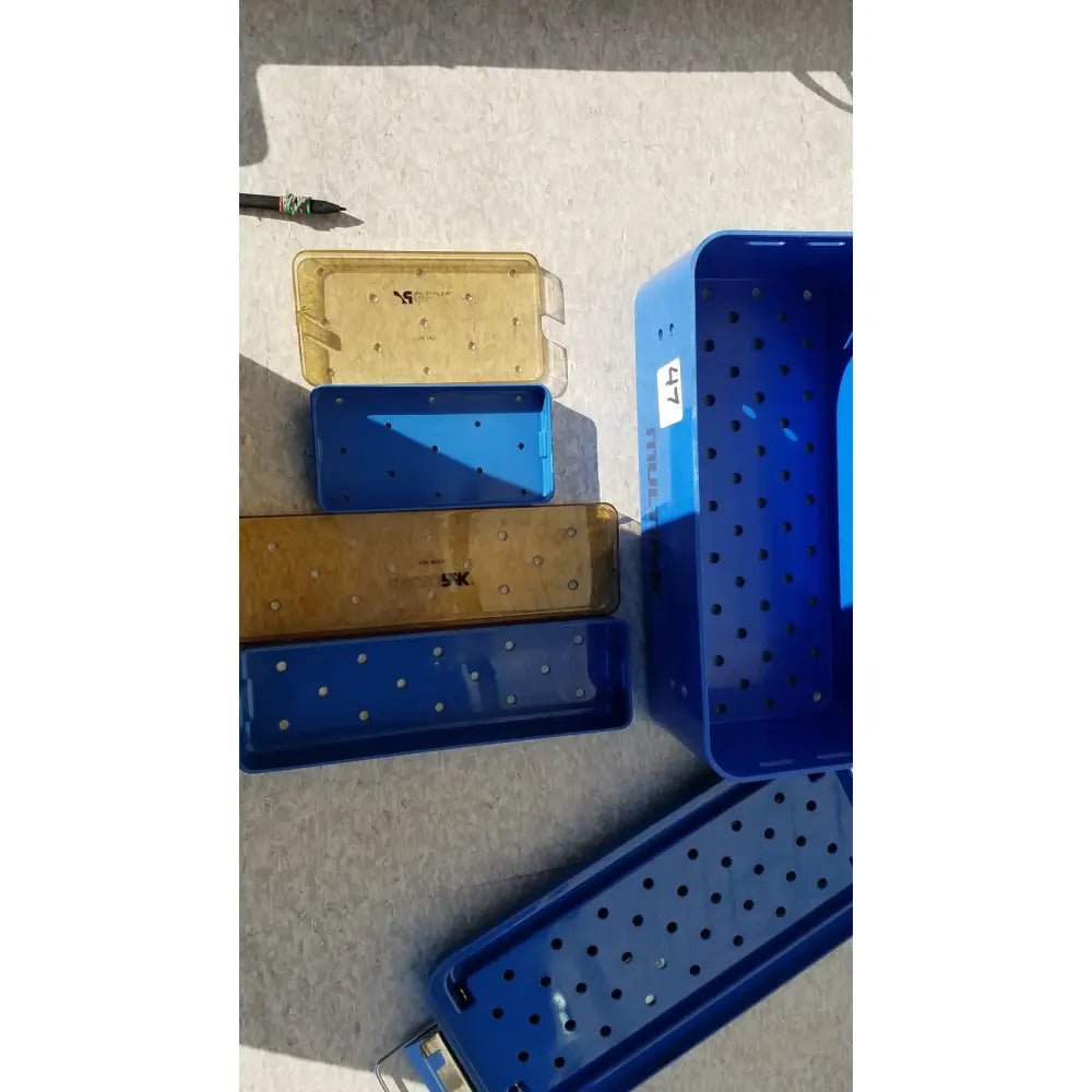 Blue plastic sterilization trays with perforated surfaces and labeled compartments multipak 5006-02-000p plastic sterilization tray