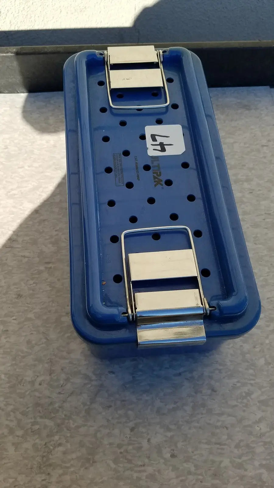 Blue plastic sterilization tray multipak 5006-02-000p with silver metal latches and white label marked 47