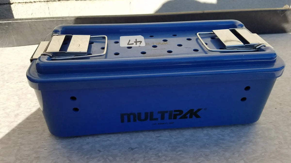 Blue plastic multipak 5006-02-000p sterilization tray with silver metal latches and perforated lid for medical use