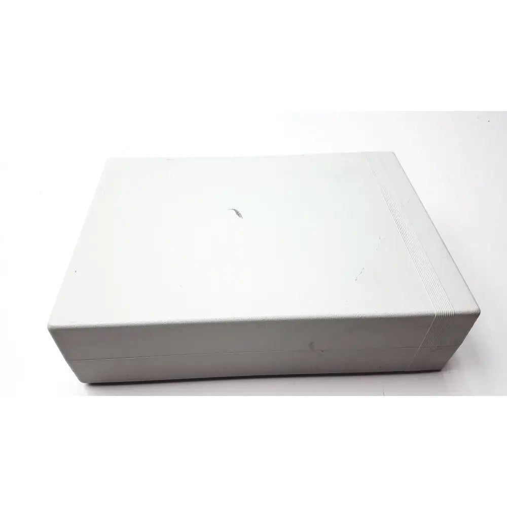 A sleek rectangular white myosure hologic hysteroscopic tissue removal control unit with textured edges and worn surface