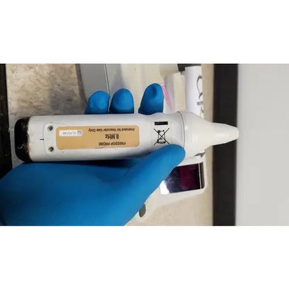 White plastic ear thermometer with black tip and beige 8 mhz label from natus neurology freedop xld004 model