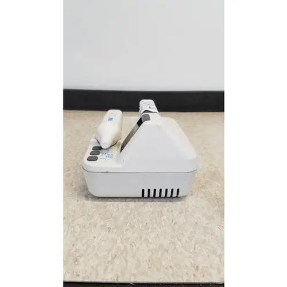 White plastic dental handpiece with black grip and control unit in natus neurology freedop xld004 model