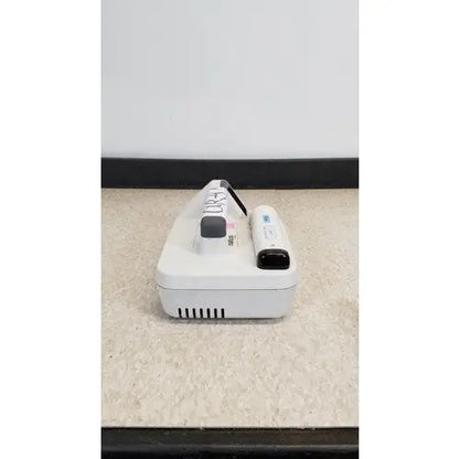 White Nintendo Wii console with controller and nunchuk for natus neurology freedop XLD004 neurology freedop product