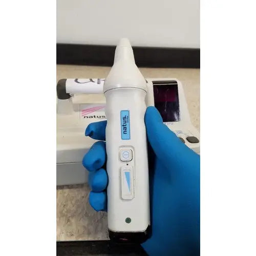 White Natus Neurology Freedop XLD004 otoscope with sleek ergonomic design and blue accent buttons for precise diagnostics