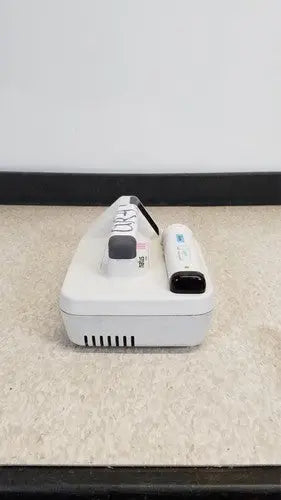 White Nintendo Wii console with controller and nunchuk for natus neurology freedop XLD004 neurology freedop product