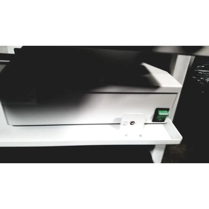 White plastic printer with green power switch of natus neurology nicolet edx base system with cart for neurology use