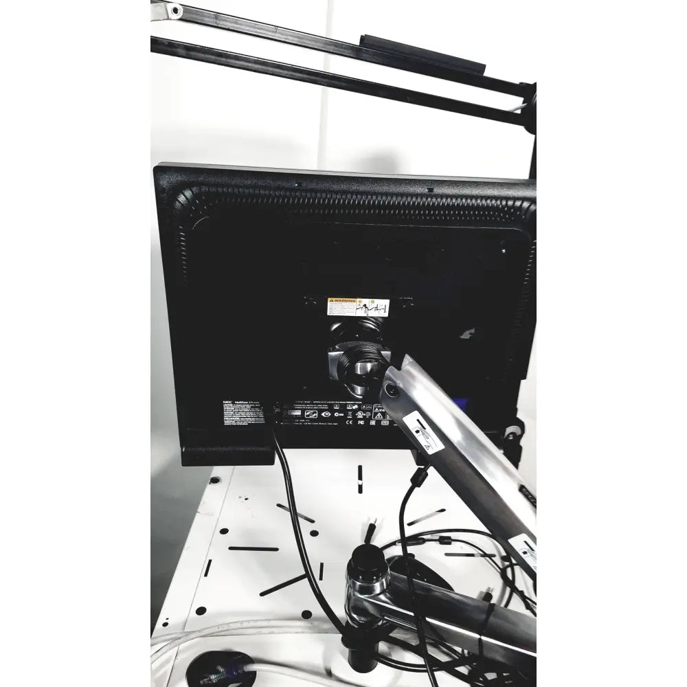 Black monitor with silver arm mount on back of natus neurology nicolet edx base system with cart