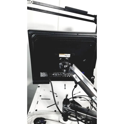 Black monitor with silver arm mount on back of natus neurology nicolet edx base system with cart