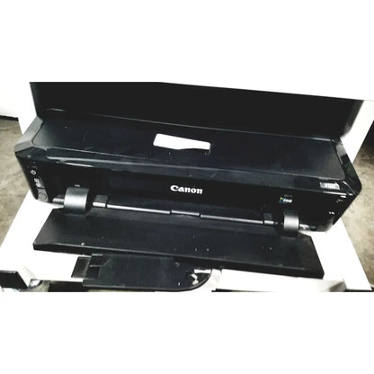 Black canon printer with sleek modern design and paper output tray in natus neurology nicolet edx base system with cart