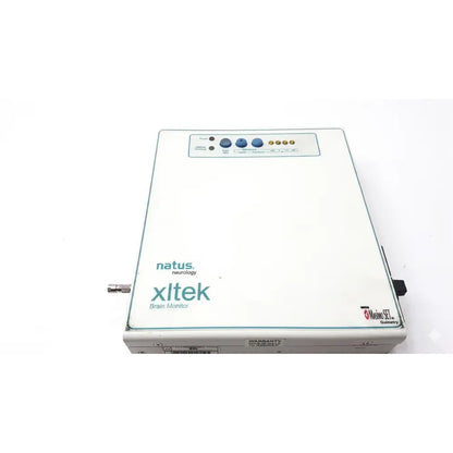 White rectangular natus neurology xltek brain monitor with blue and gold control buttons on the top panel