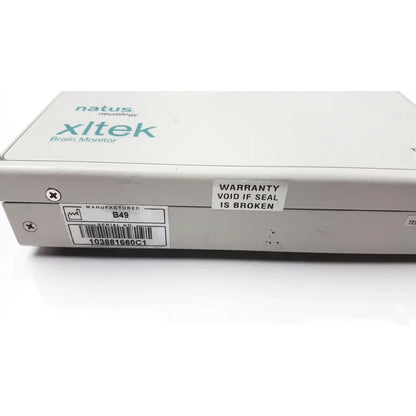 White rectangular natus neurology xltek brain monitor with branding and warranty sticker on its side for neurological use