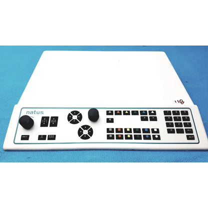 White natus ultrapro s100 unit control panel with black knobs buttons and numeric keypad for video production control
