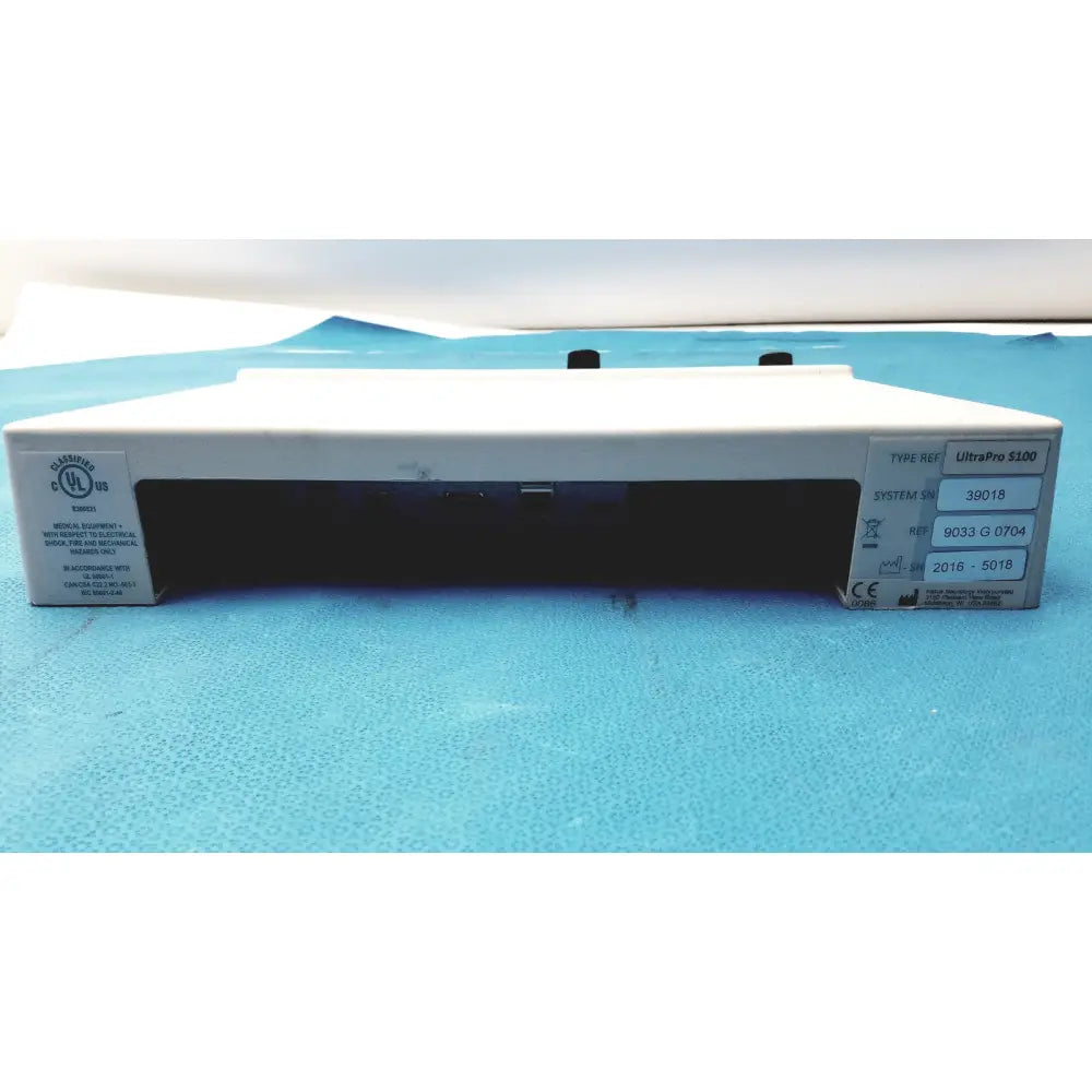 White rectangular medical device with black ports and silver labeling, the natus ultrapro s100 unit control panel