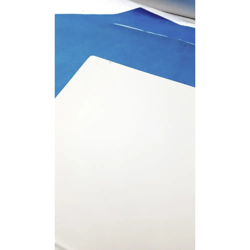 White rectangular cutting mat with textured surface on blue film for natus ultrapro s100 unit control panel use