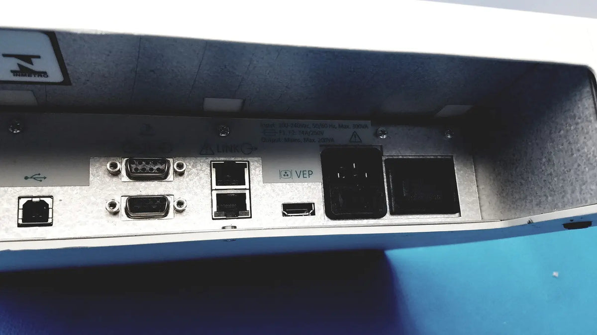 Silver metallic back side of natus ultrapro s100 unit control panel with multiple ports including usb ethernet and hdmi connectors