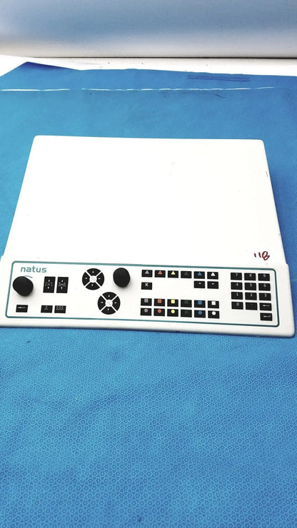 White plastic natus ultrapro s100 unit control panel with black knobs, buttons, and numeric keypad for medical use