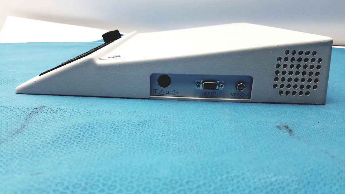 White plastic natus ultrapro s100 unit control panel with triangular shape featuring rs-232 serial port and audio jacks on side