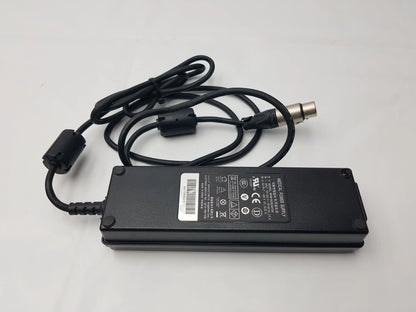 Black rectangular NDS BPM150S24F06 medical power supply AC adapter with coiled cable and metallic connector