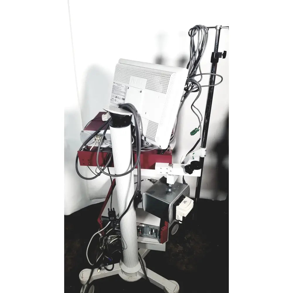 White nec laborie aquarius ct urodynamic analyzer with red black components mounted on wheeled stand with multisync lcd
