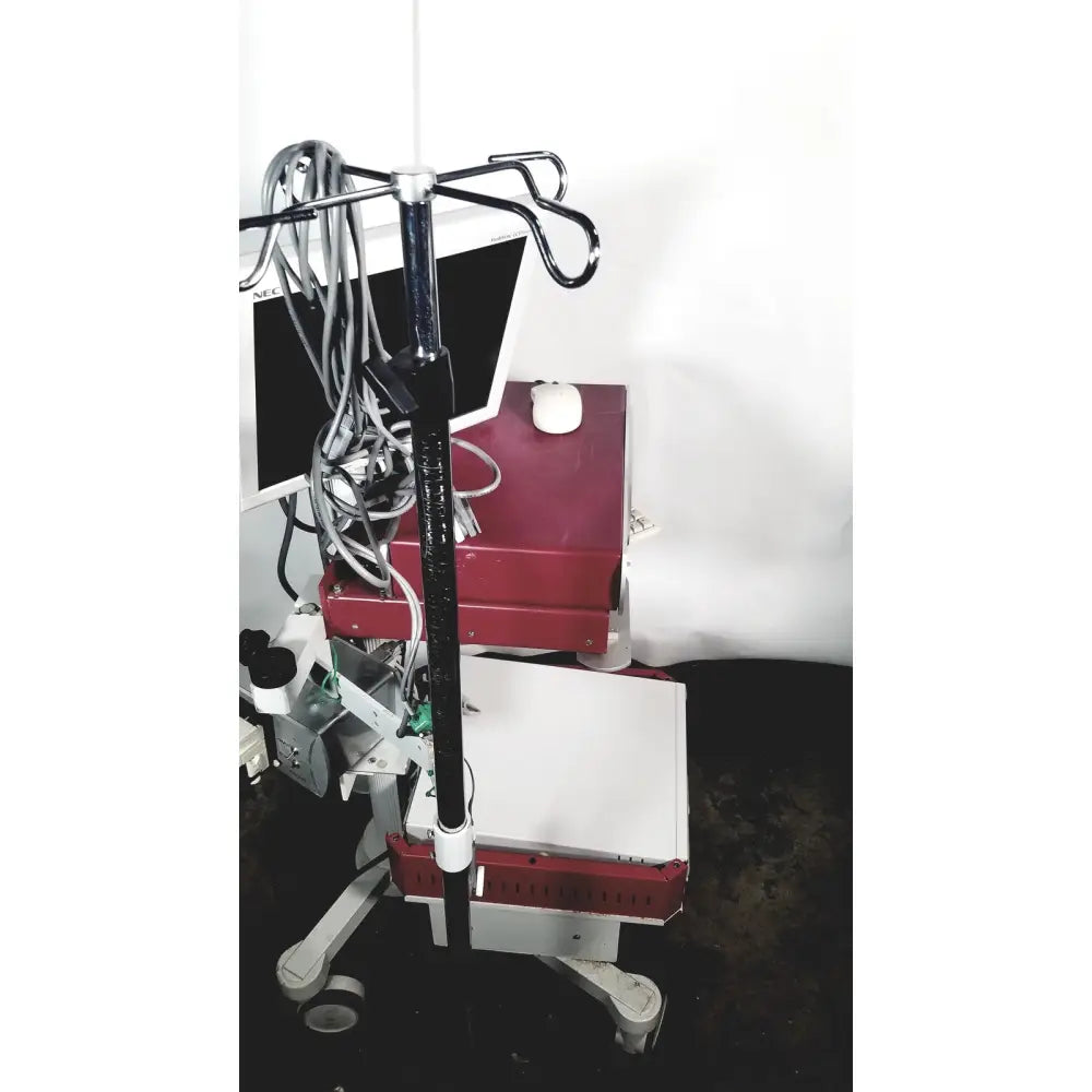 Red and white nec laborie aquarius ct urodynamic analyzer cart with black iv pole, trays, wheels, and cables