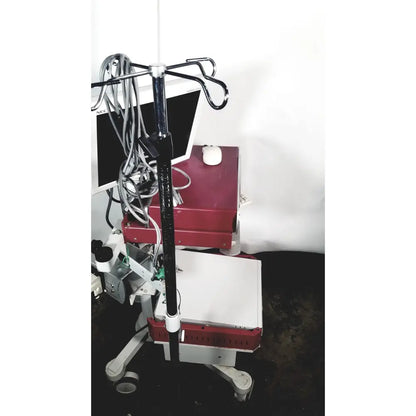 Red and white nec laborie aquarius ct urodynamic analyzer cart with black iv pole, trays, wheels, and cables