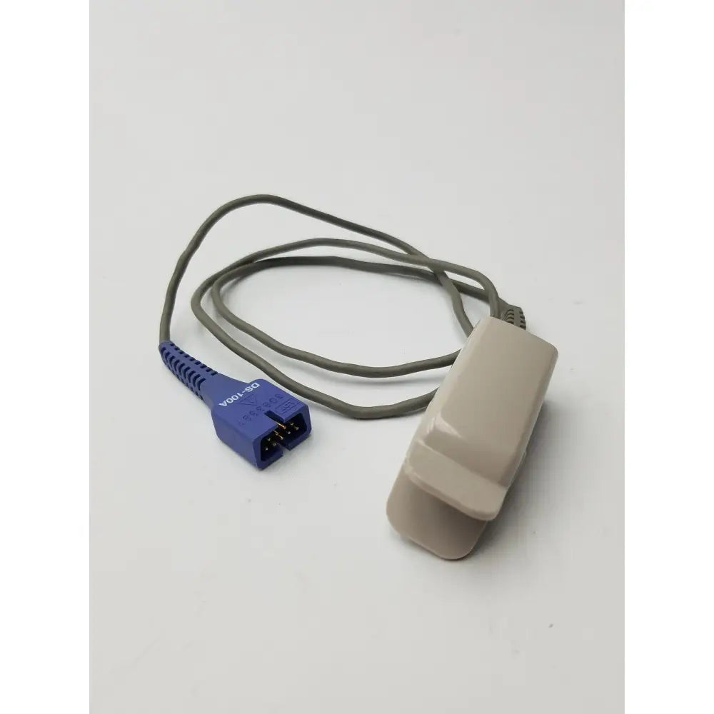 Beige plastic nellcor compatible direct connect spo2 sensor with gray cable and blue connector for adult clip use