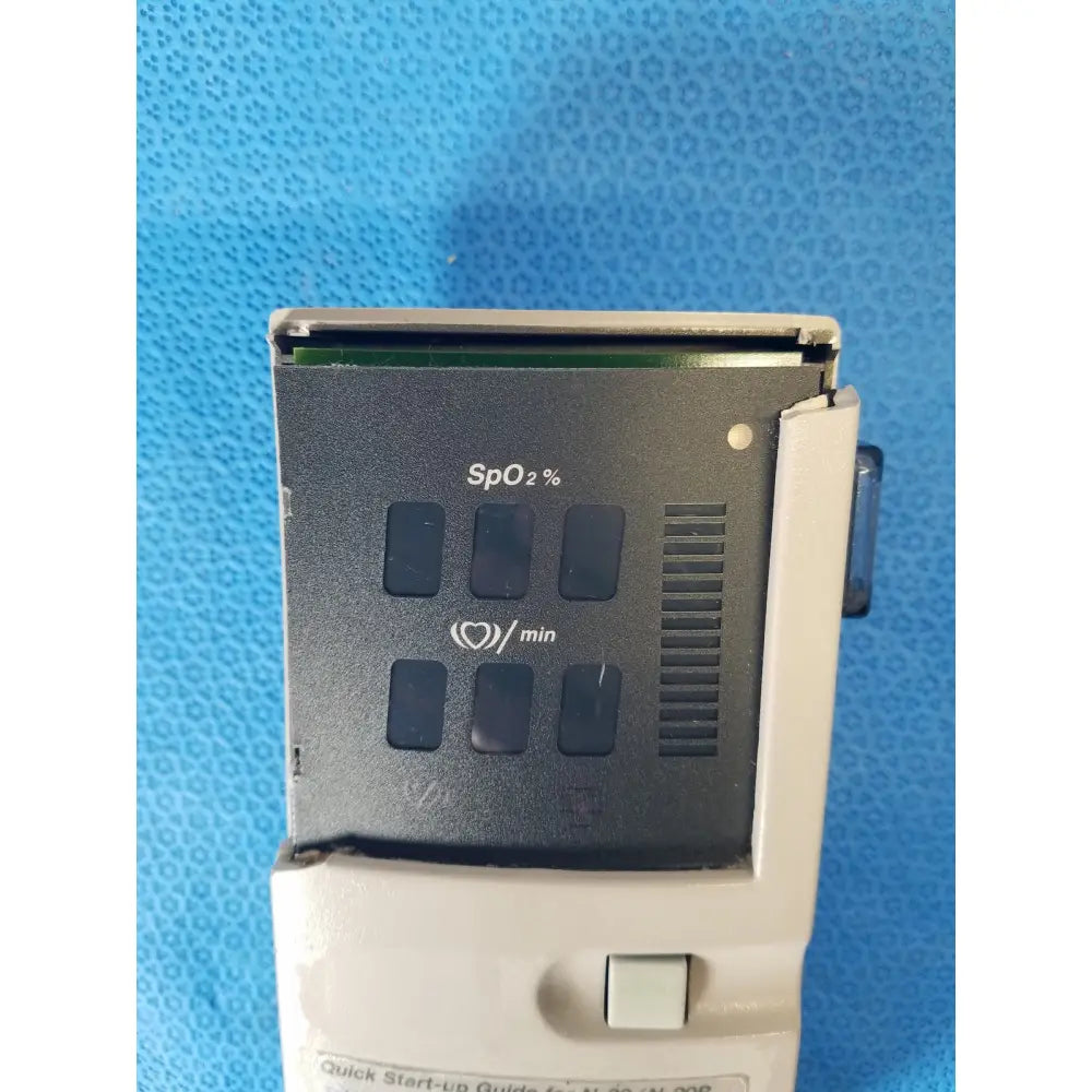 Gray and black nellcor puritan bennett n-20 portable pulse oximeter with digital spo2 and heart rate display in case