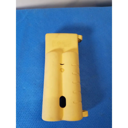 Yellow plastic grip with textured surface and molded contours on nellcor puritan bennett n-20 portable pulse oximeter