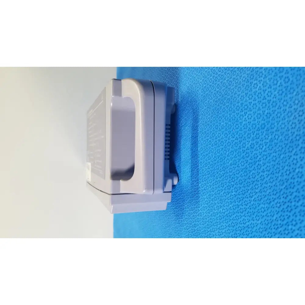 Gray plastic wall-mounted Nellcor Puritan Bennett OxiMax N-560 pulse oximeter SPO2 patient monitor with ventilation slots