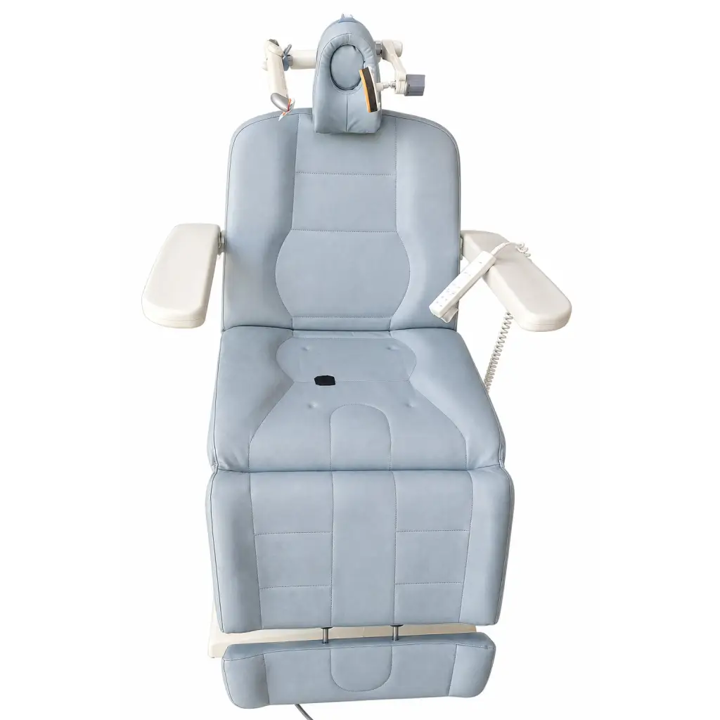 Light blue padded neuronetics neurostar TMS therapy patient chair with adjustable headrest and armrests