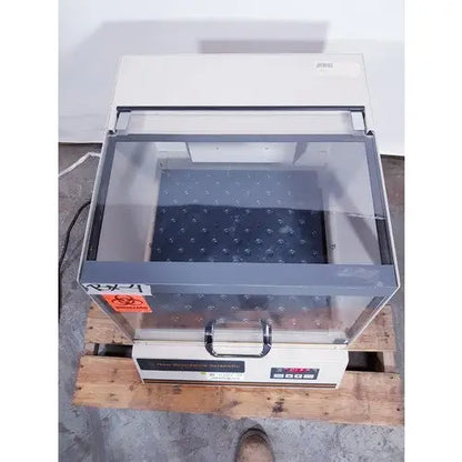 Beige and gray laboratory-grade biosafety cabinet with glass front and digital control panel by brunswick scientific classic c24