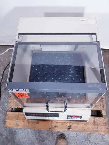 Beige and gray laboratory-grade biosafety cabinet with glass front and digital control panel by brunswick scientific classic c24