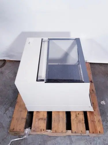 White rectangular industrial machine with transparent glass panel and metallic frame brunswick scientific classic c24