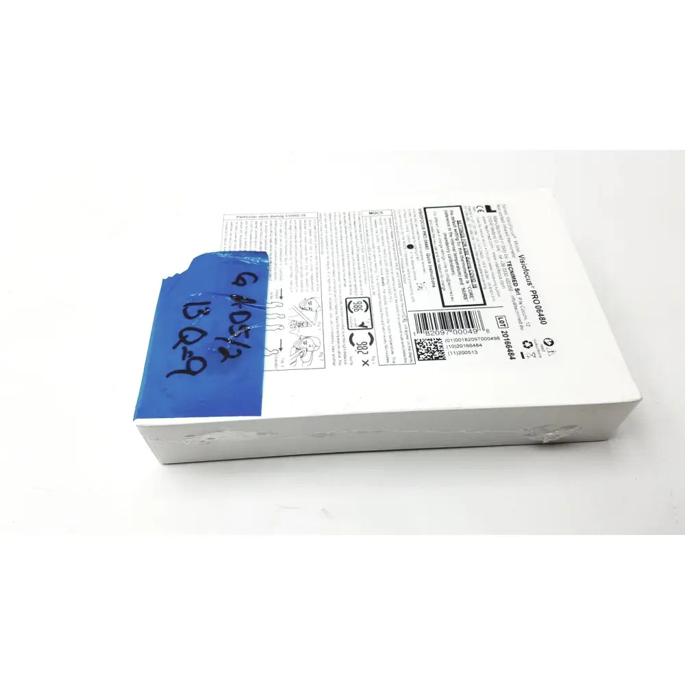 White rectangular box with blue tape showing the back side of visiofocus pro professional non-contact forehead infrared thermometer packaging