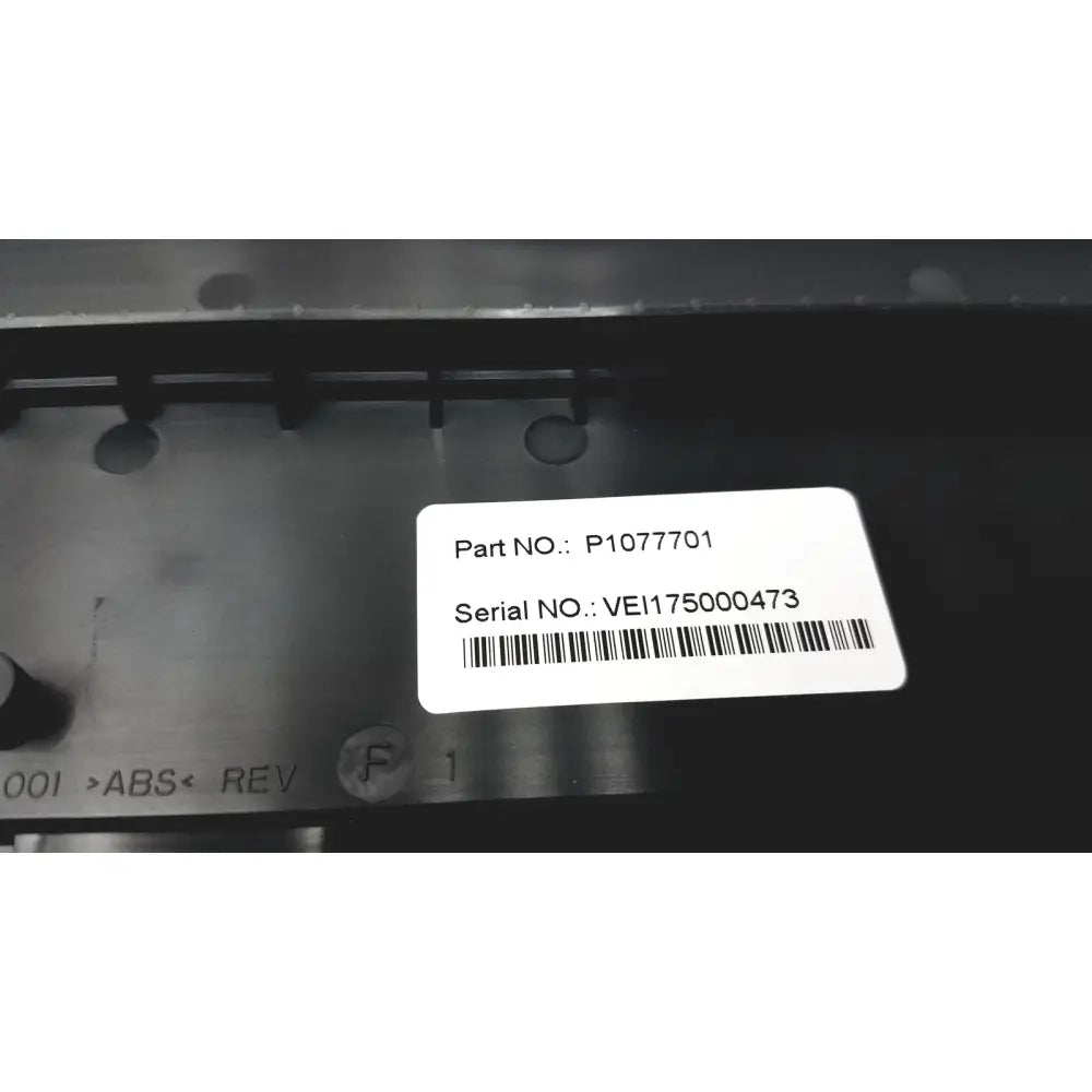 White rectangular label with black text and barcode on dark metal surface of new zebra p1080383-042 cutter option upgrade kit zd420