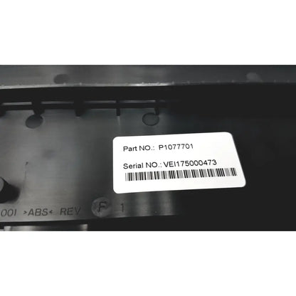 White rectangular label with black text and barcode on dark metal surface of new zebra p1080383-042 cutter option upgrade kit zd420