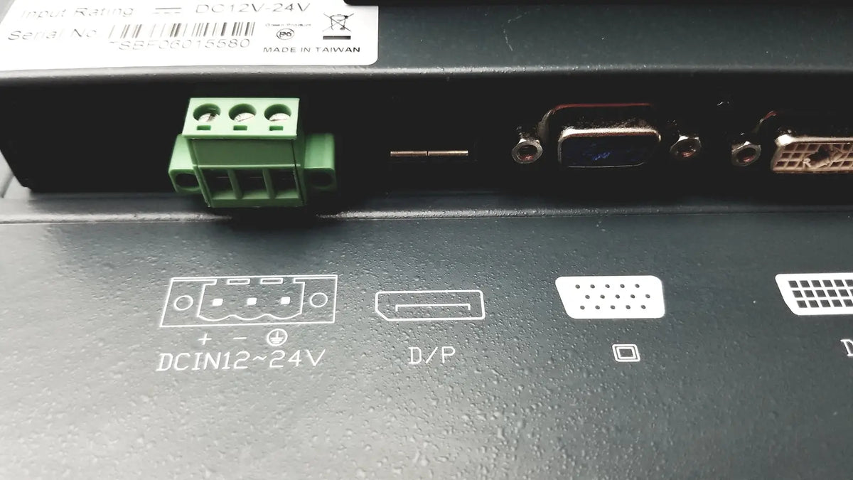 Black nexcom ippd2100p multimedia panel pc back with green terminal block and vga dvi hdmi ports visible