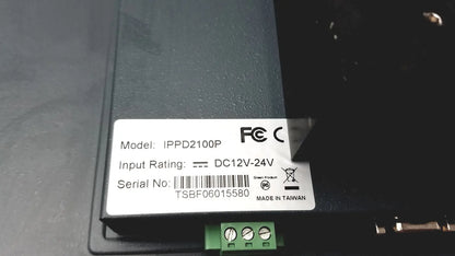 Black rectangular power supply unit with white label ippd2100p and green terminal block for nexcom ippd2100p multimedia panel