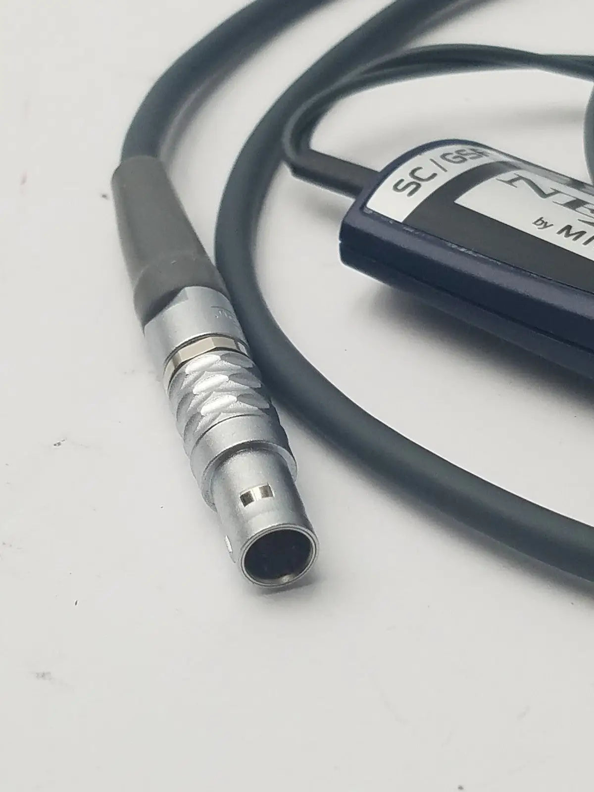 Black and silver sc 639 connector cable with textured metallic housing for nexus skin conductance reuse medical sensor